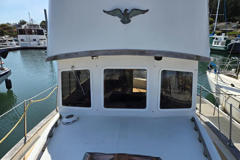 Slide: The Image of 1973 Willard Marine Vega Nomad Flybridge boat docked in a marina. - 4