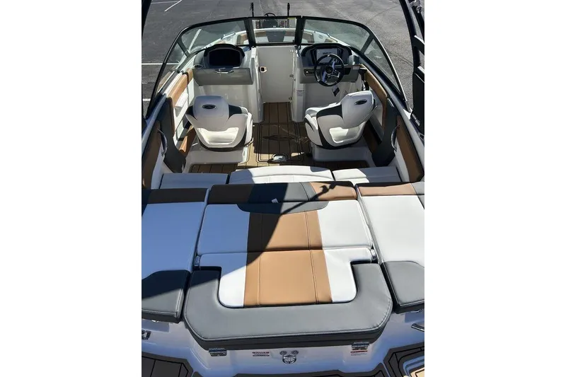 Slide: The Image of 2026 Chaparral 21 SSi boat interior with modern seating and steering wheel. - 4