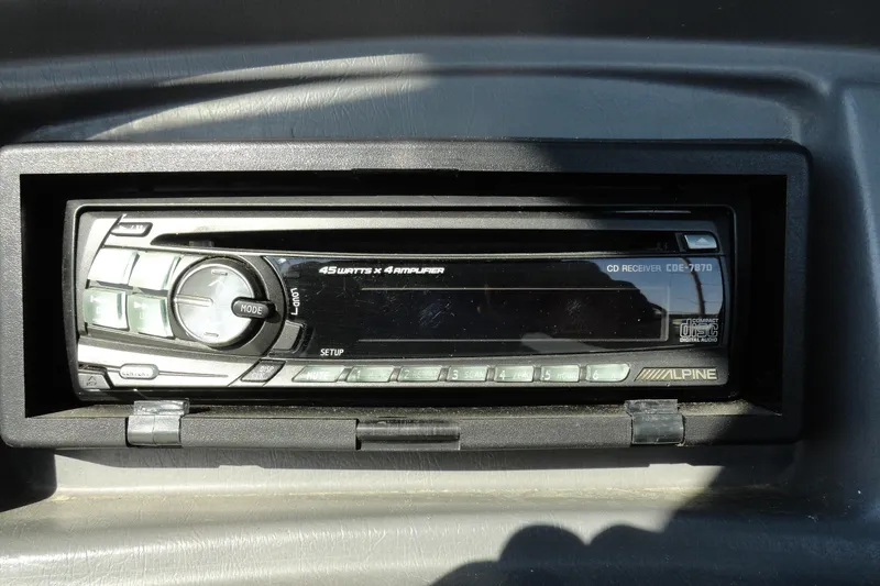 Slide: The Image of Alpine CD receiver in 1995 Wellcraft Eclipse 196 S boat dashboard. - 11