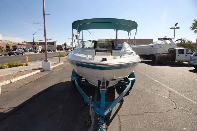 Slide: The Image of 1995 Wellcraft Eclipse 196 S boat on trailer in parking lot. - 3