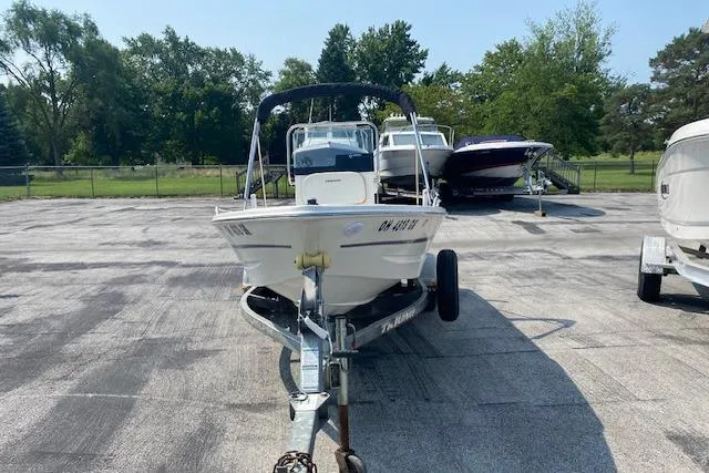 Slide: The Image of 2015 Triumph 170 CC boat on trailer in outdoor storage area. - 1