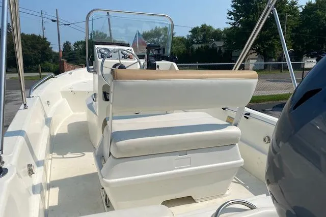 Slide: The Image of 2015 Triumph 170 CC boat interior with seating and steering console. - 5