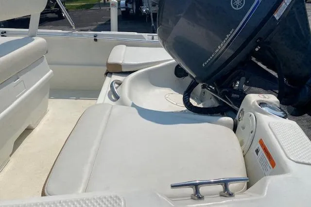 Slide: The Image of 2015 Triumph 170 CC boat interior with Yamaha outboard motor, featuring white seating. - 6