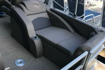 Slide: The Image of 2019 Bennington 22 SCWXP boat interior with comfortable seating and cup holders. - 15