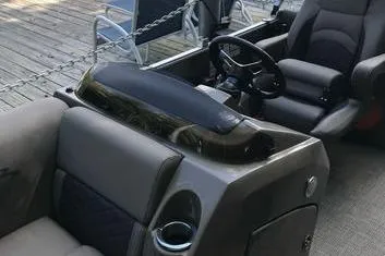 Slide: The Image of 2019 Bennington 22 SCWXP boat interior with steering wheel and seating. - 17