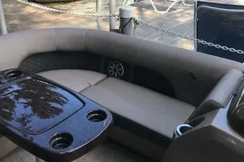 Slide: The Image of 2019 Bennington 22 SCWXP boat interior with seating and table. - 19