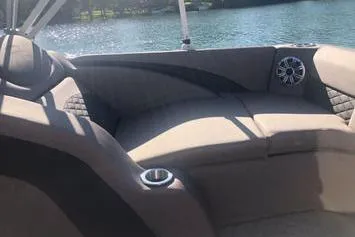 Slide: The Image of 2019 Bennington 22 SCWXP boat interior with cushioned seating and cup holder. - 22