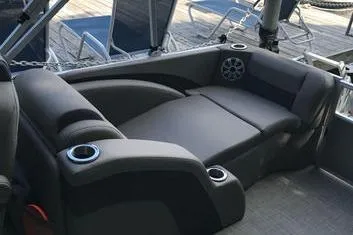 Slide: The Image of 2019 Bennington 22 SCWXP boat interior with cushioned seating and cup holders. - 23