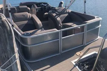 Slide: The Image of 2019 Bennington 22 SCWXP pontoon boat with seating, on calm water. - 26