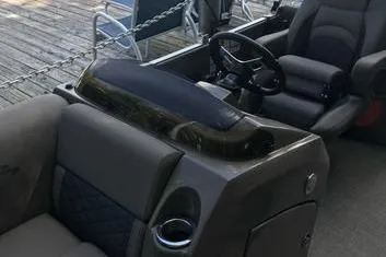 Slide: The Image of 2019 Bennington 22 SCWXP boat interior with steering wheel and seating. - 29