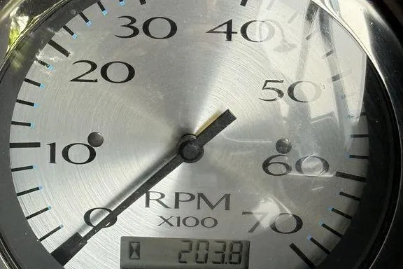 Slide: The Image of Close-up of a 2019 Bennington 22 SCWXP RPM gauge displaying 2038 RPM. - 4