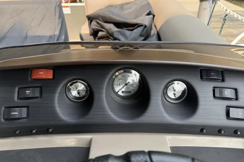 Slide: The Image of Dashboard of a 2019 Bennington 22 SCWXP boat with gauges and switches. - 5