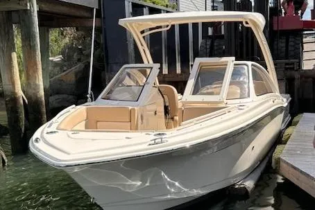 Slide: The Image of 2024 Scout 240 Dorado boat docked, showcasing sleek design and modern features. - 3