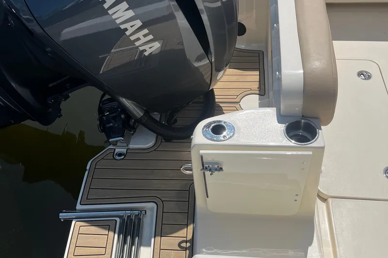 Slide: The Image of 2024 Scout 240 Dorado boat with Yamaha engine and teak deck details. - 5