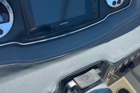 Slide: The Image of Dashboard of 2019 Chaparral 250 Suncoast boat with Garmin display and controls. - 10