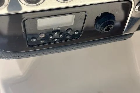 Slide: The Image of Control panel of a 2019 Chaparral 250 Suncoast boat. - 11