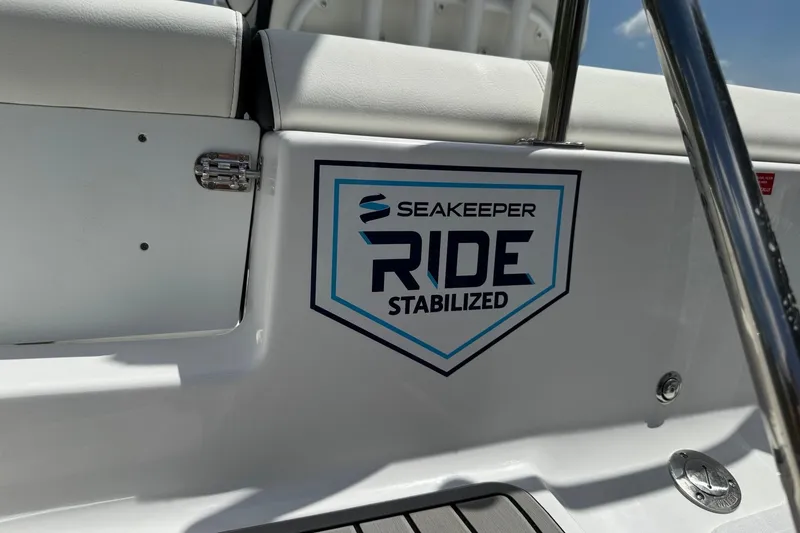 Slide: The Image of 2026 Tidewater 232 LXF boat featuring Seakeeper Ride Stabilized technology logo. - 11