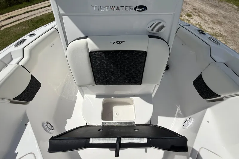 Slide: The Image of 2026 Tidewater 232 LXF boat interior with cushioned seating and storage compartment. - 36