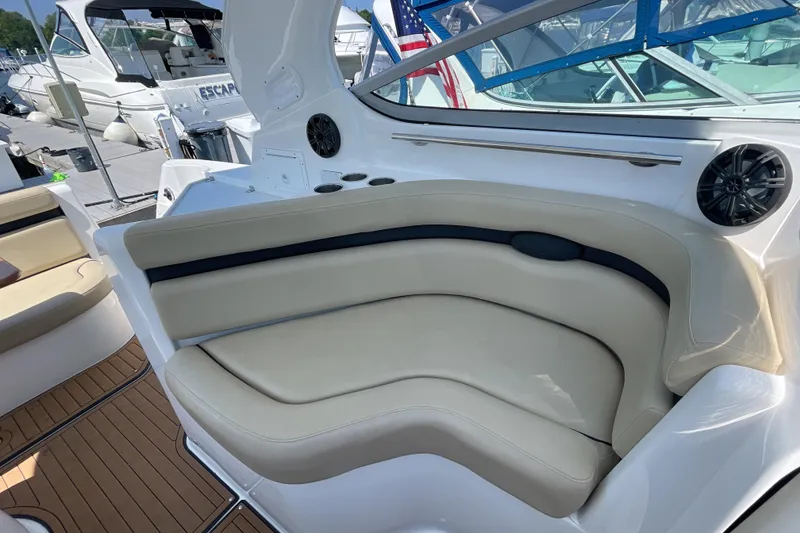 Slide: The Image of Manufacturer Provided Image: 2017 Rinker EX 370 boat interior with beige seating and advanced navigation controls. - 15