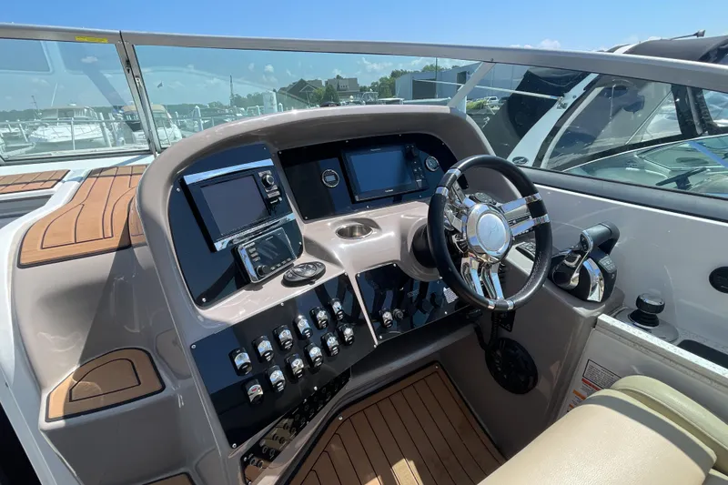 Slide: The Image of Manufacturer Provided Image: 2017 Rinker EX 370 boat helm with advanced navigation and control systems. - 19