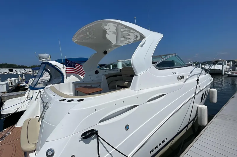Slide: The Image of 2017 Rinker EX 370 helm with modern controls and navigation systems. - 2
