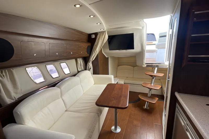Slide: The Image of Manufacturer Provided Image: Luxurious interior of 2017 Rinker EX 370 yacht with cozy seating and modern amenities. - 25