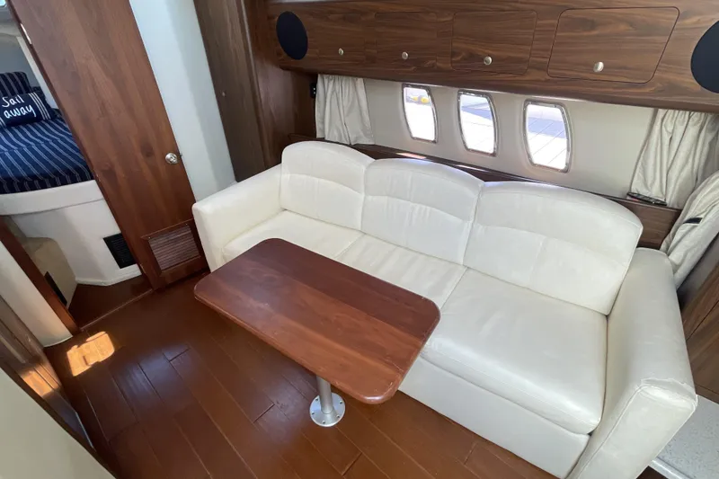 Slide: The Image of 2017 Rinker EX 370 yacht kitchen with microwave, sink, and compact fridge. - 27