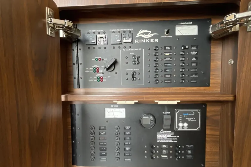 Slide: The Image of 2017 Rinker EX 370 boat docked at marina under clear blue sky. - 40