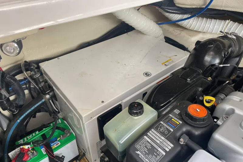 Slide: The Image of 2017 Rinker EX 370 yacht docked at marina under clear blue sky. - 44