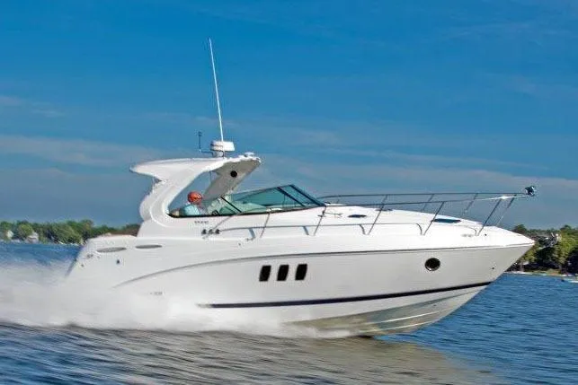 Slide: The Image of 2017 Rinker EX 370 boat in a spacious indoor storage facility. - 5