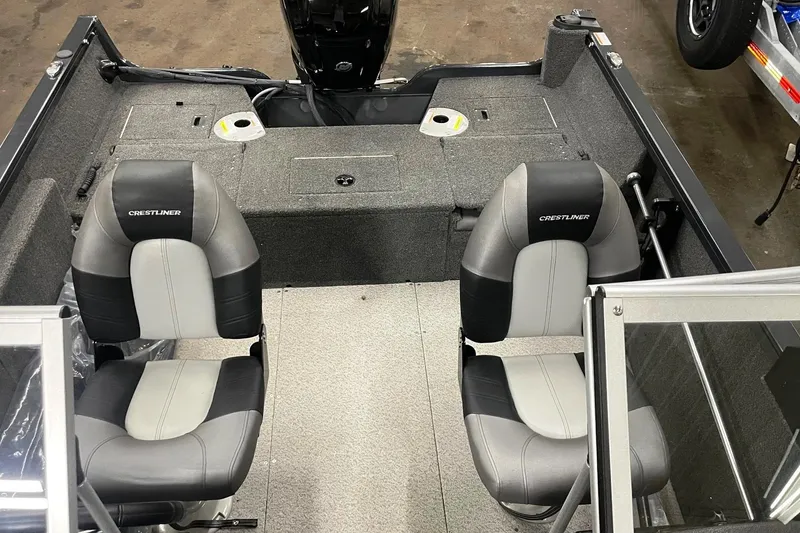 Slide: The Image of 2019 Crestliner 1650 Fish Hawk WT JS interior with two seats and motor view. - 3