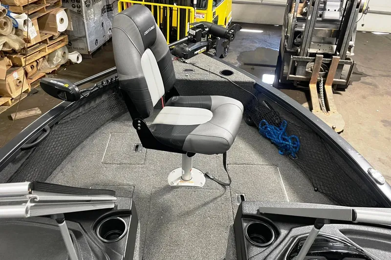 Slide: The Image of 2019 Crestliner 1650 Fish Hawk WT JS boat interior with swivel seat and fishing equipment. - 6