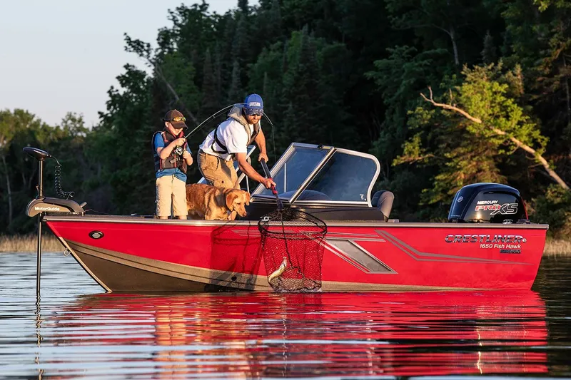Slide: The Image of Manufacturer Provided Image: 2019 Crestliner 1650 Fish Hawk WT JS boat with people fishing and a dog on board. - 7
