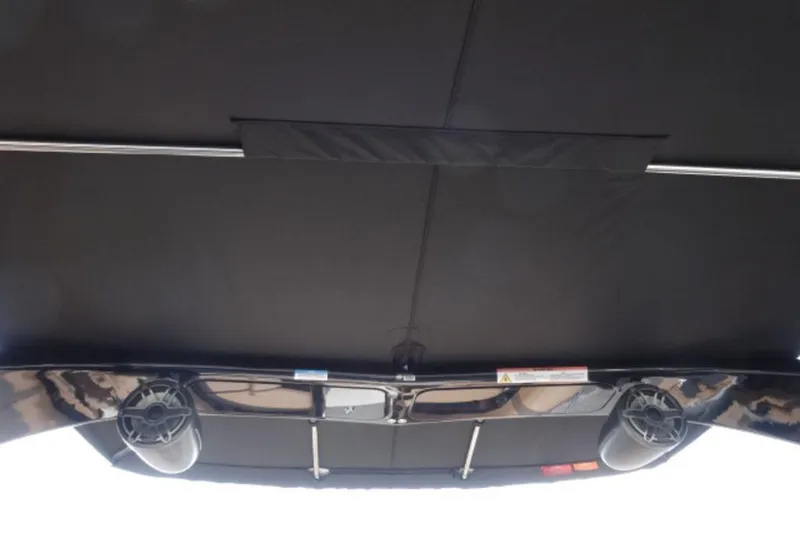Slide: The Image of 2026 Harris Grand Mariner 250 boat canopy with speakers and support bars. - 16