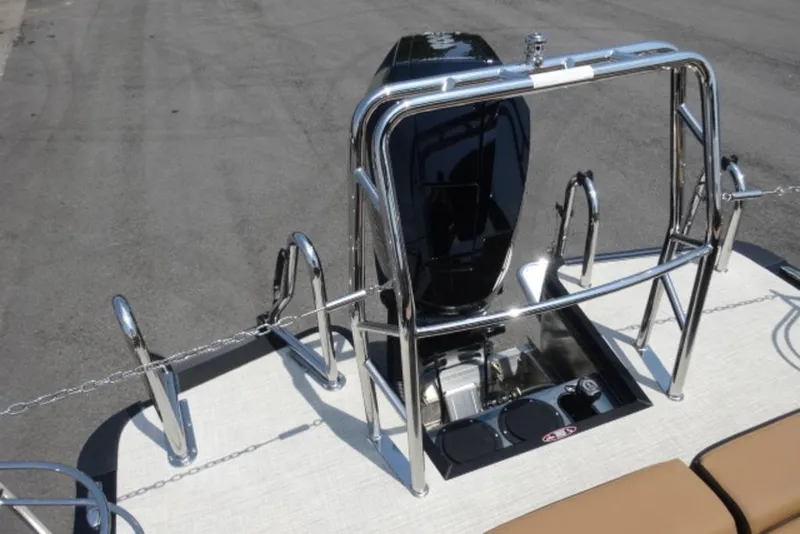 Slide: The Image of 2026 Harris Grand Mariner 250 boat engine with sleek chrome railing and beige deck. - 17