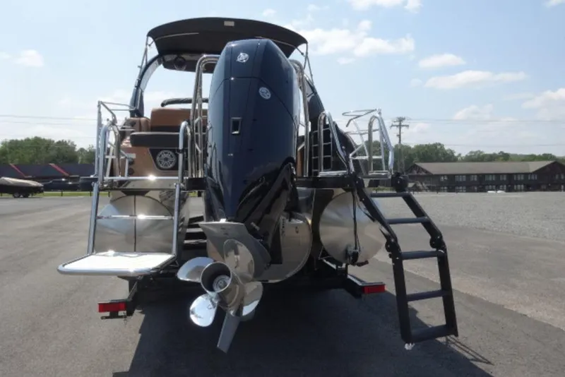 Slide: The Image of 2026 Harris Grand Mariner 250 boat rear view with outboard motor and ladder. - 3