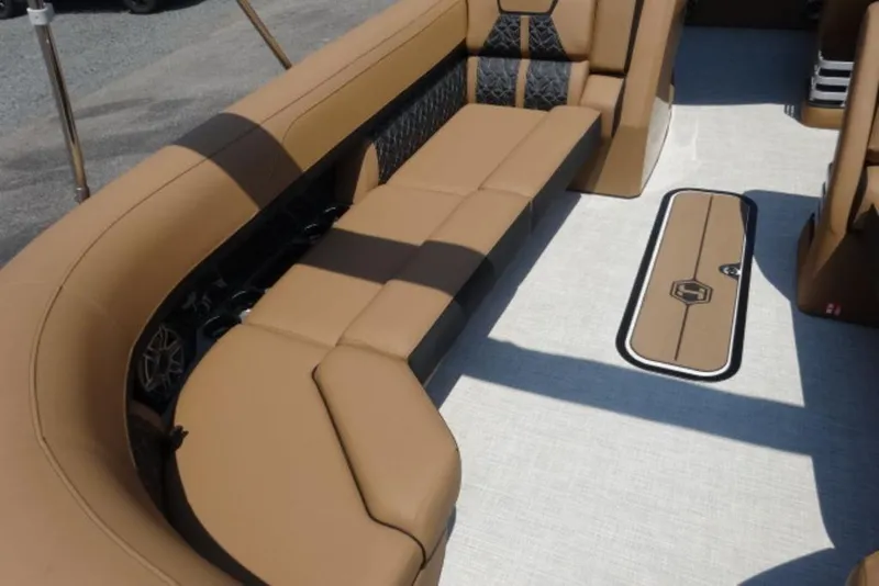 Slide: The Image of Luxurious seating on 2026 Harris Grand Mariner 250 pontoon boat, featuring tan upholstery. - 6
