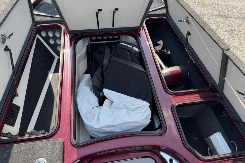 Slide: The Image of 2014 Ranger Z521 Comanche boat storage compartments with gear and equipment. - 17