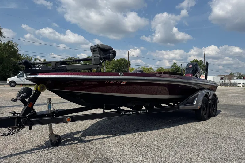 Slide: The Image of 2014 Ranger Z521 Comanche boat on trailer under a partly cloudy sky. - 4