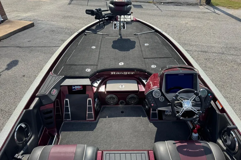 Slide: The Image of 2014 Ranger Z521 Comanche boat interior with steering wheel and control panel. - 7
