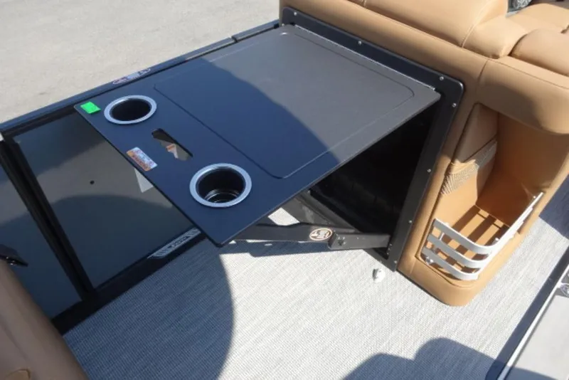 Slide: The Image of Harris Grand Mariner 250 (2026) boat interior with cup holders and storage compartment. - 10