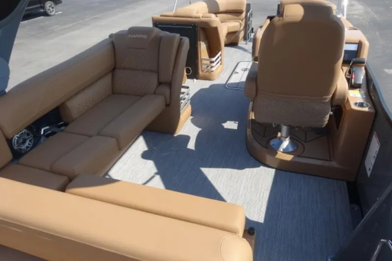 Slide: The Image of 2026 Harris Grand Mariner 250 interior with luxurious tan seating and modern design. - 11