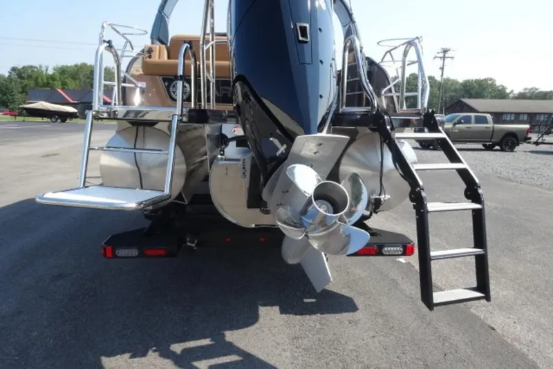 Slide: The Image of 2026 Harris Grand Mariner 250 pontoon boat rear view with propeller and ladder. - 3