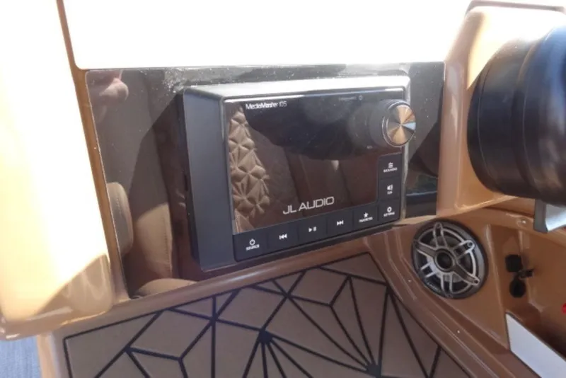Slide: The Image of 2026 Harris Grand Mariner 250 dashboard with JL Audio system and speaker. - 4