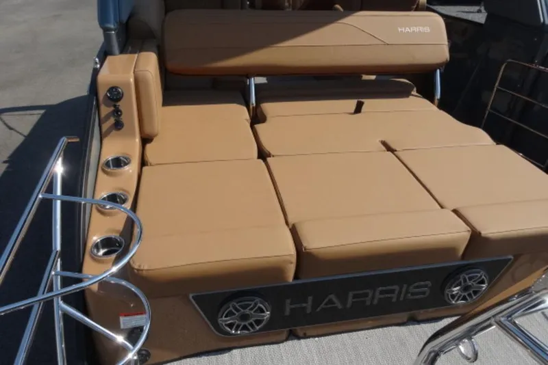 Slide: The Image of 2026 Harris Grand Mariner 250 boat with tan seating and cup holders. - 9