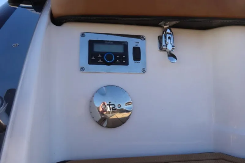 Slide: The Image of Control panel on 2026 Chaparral 30 Surf boat, featuring trim and audio controls. - 11