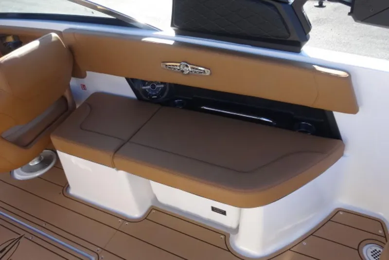 Slide: The Image of 2026 Chaparral 30 Surf boat interior with tan seating and sleek design. - 14