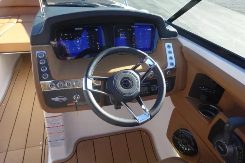 Slide: The Image of 2026 Chaparral 30 Surf boat dashboard with modern controls and steering wheel. - 20