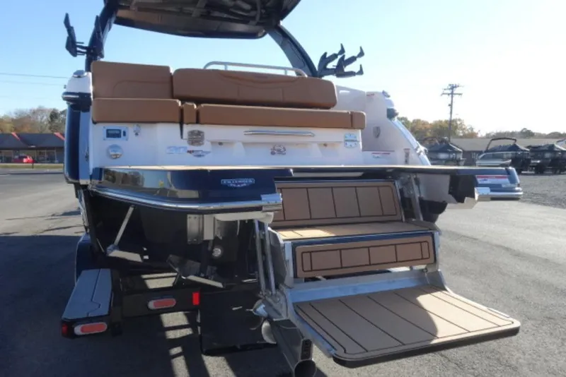 Slide: The Image of 2026 Chaparral 30 Surf boat rear view with extended swim platform. - 4