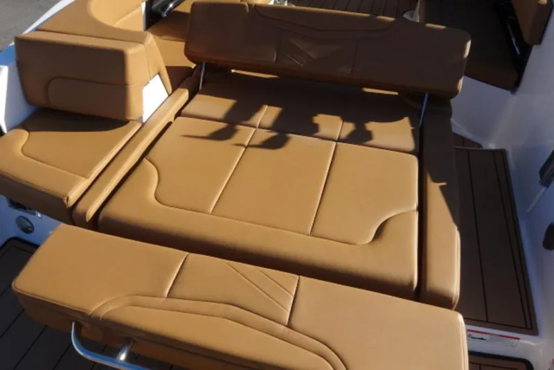 Slide: The Image of 2026 Chaparral 30 Surf boat with luxurious tan leather seating. - 6